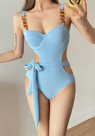 Black ribbed one-piece swimsuit with sweetheart neckline, chain-link shoulder strap, side cut-outs, and self-tie waist. - Image 8