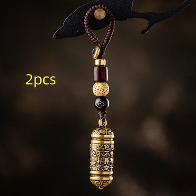 Llavero Colgante Tubo de Latón con Sutra del Corazón Tibetano - Image 8