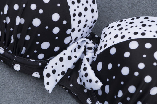 Retro black and white polka dot bikini with a tie-front top and high-waisted bottom. - Image 4
