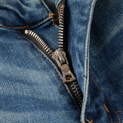 Jeans Vintage Desgastados con Parches de Cuero y Diseño Patchwork para Hombre - Image 24