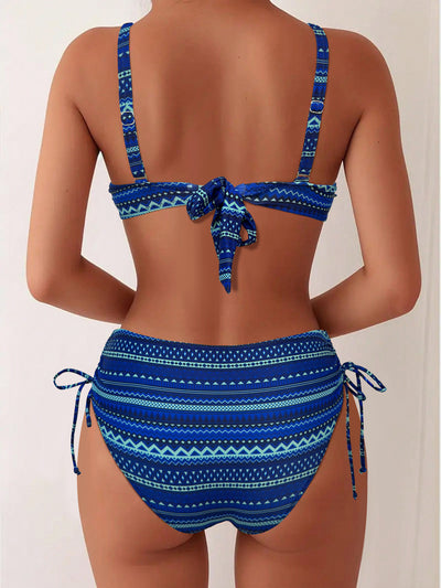 Blue, white, and black geometric print bikini with spaghetti strap bandeau top and high-waisted side-tie bottoms. - Image 16