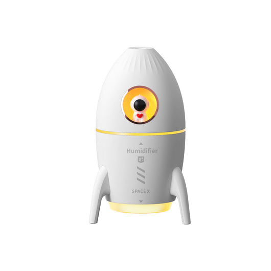 Pink rocket-shaped humidifier with an astronaut figurine in a circular window and a glowing yellow light band. - Image 9