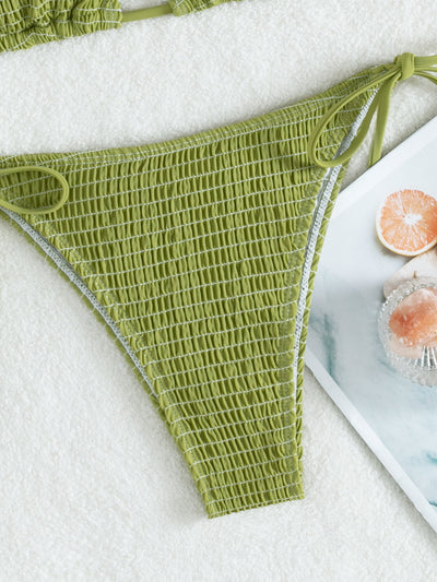 Women's lime green halter bikini with spaghetti straps and thong bottom, modeled outdoors against a blue sky. - Image 28