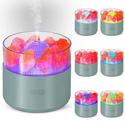 White cool-mist humidifier and aroma diffuser with glowing blue LED lights and orange crystal salt rocks, emitting mist. - Image 2