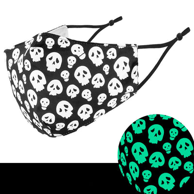 Black cloth face mask with white Halloween witch, bats, and jack-o'-lantern pattern, shown glowing green in the dark. - Image 8