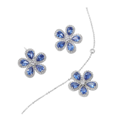 Elegant jewelry set with a silver-tone necklace and matching stud earrings, featuring blue and clear floral gemstones. - Image 3