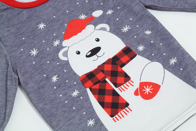 Family of five wearing matching gray and red buffalo plaid Christmas pajamas with polar bear print. - Image 14