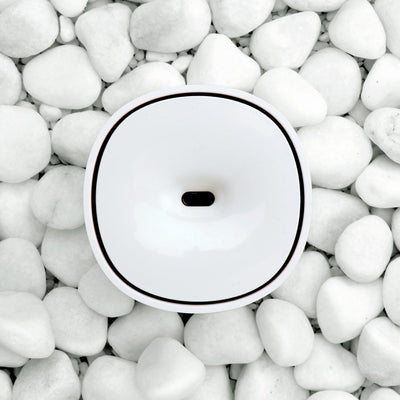 White mini aromatherapy machine with a minimalist design, featuring a top mist outlet and a single control button. - Image 3