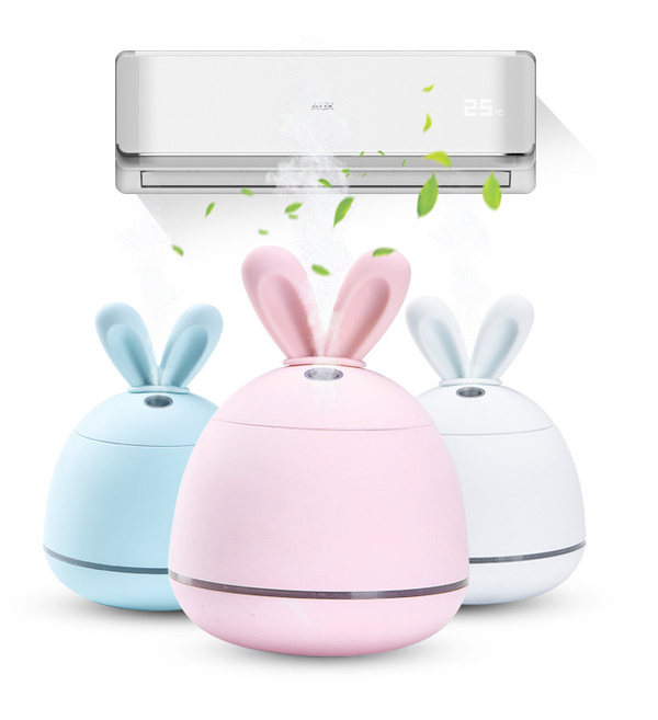 Cute pink rabbit desktop mini USB humidifier with a silver band, featuring a compact egg shape and bunny ears.