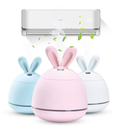 Cute pink rabbit desktop mini USB humidifier with a silver band, featuring a compact egg shape and bunny ears.