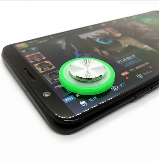 Pink and silver mobile game joystick attached to a black smartphone displaying a game on its screen. - Image 13