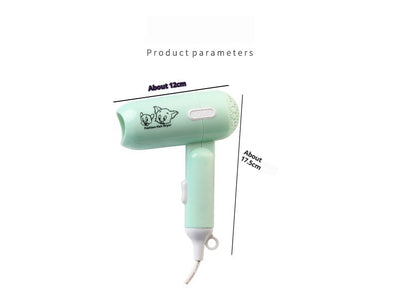 Light blue foldable hair dryer with a cartoon pig design, white power switch, and hanging loop. - Image 14