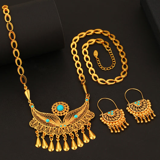 Gold-toned necklace and dangle earrings set with filigree water droplet design, turquoise accents, and tassel charms. - Image 3