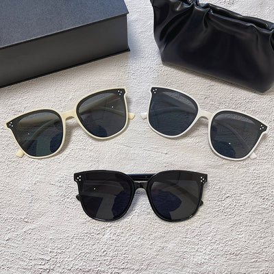 Cream square-style sunglasses with dark lenses, featuring small silver accents on the frame corners. - Image 18