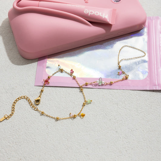 Gold-colored bracelet with a chain of small, interconnected heart-shaped links, featuring a lobster clasp and extender. - Image 19