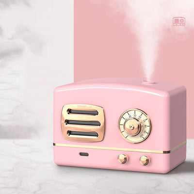 White retro humidifier with rose gold accents, designed like a vintage radio, emitting a fine mist. - Image 5