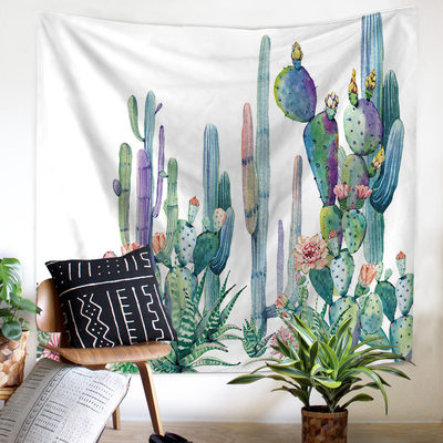 Tropical leaf and pink flamingo tapestry with "GOOD MORNING" text, hanging above a bed in a bright room.