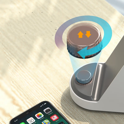 White and gray trapezoidal humidifier with a rose gold top mist outlet and control knob on a wooden desk. - Image 5