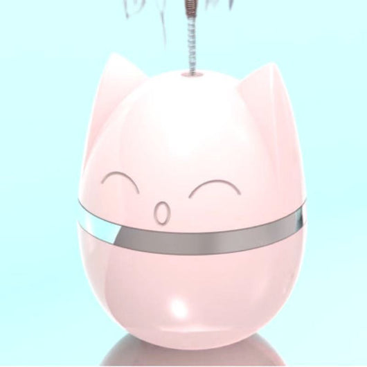 Pink cat-shaped tumbler toy with a feather attachment, featuring a cute face and silver band. - Image 4