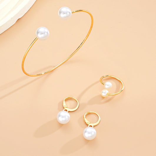 Gold-tone open cuff bracelet, matching open ring, and dangle earrings, all featuring white faux pearls. - Image 8