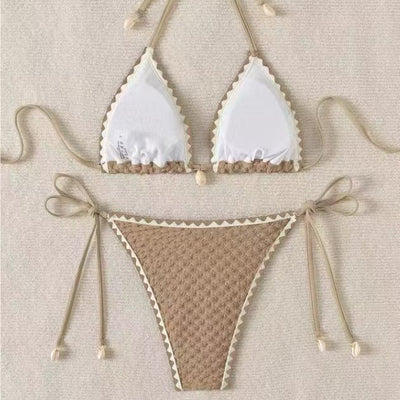 Black textured bikini with white scalloped trim, halter top, and tie-side bottoms featuring small shell details. - Image 3