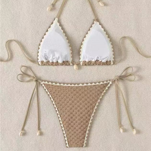 Black textured bikini with white scalloped trim, halter top, and tie-side bottoms featuring small shell details. - Image 3