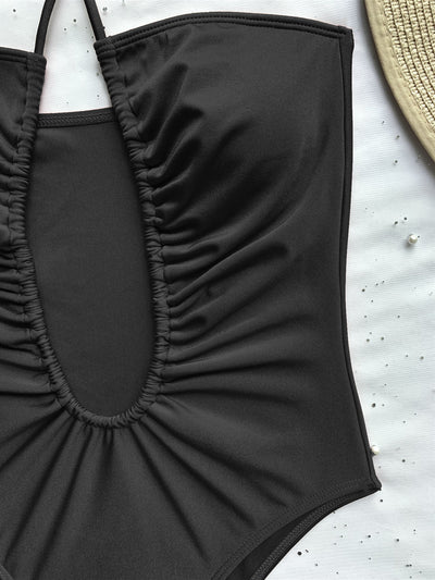 Black one-piece swimsuit with a halter neck and deep V-neckline, featuring ruched detailing on the bust. - Image 6