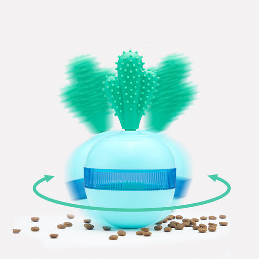 Light blue pet food dispensing ball toy with a translucent blue band and a green cactus-shaped top. - Image 10