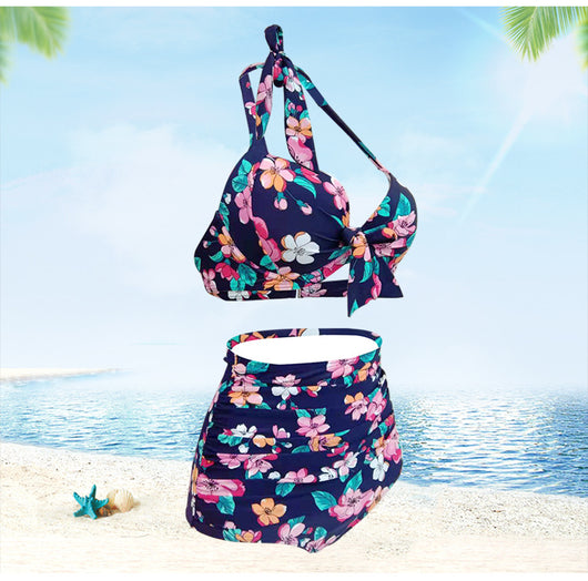 Navy blue floral high-waisted bikini with a halter top and front tie knot, featuring pink, orange, and white flowers. - Image 2