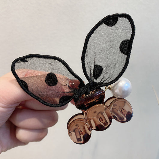 Black sheer polka dot rabbit ears hair claw clip with a faux pearl and gold-toned metal accents. - Image 4
