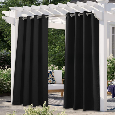 Solid gray outdoor curtain panels with grommet tops hanging from a white pergola on a sunny patio. - Image 14