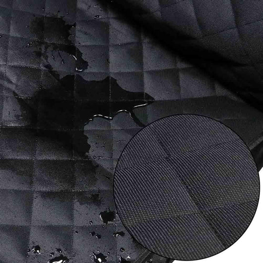 Black quilted pet car seat cover installed on a front passenger seat, protecting the upholstery. - Image 10