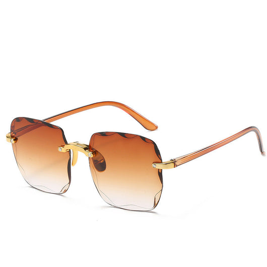 Pink rimless square sunglasses with wavy edges, gold-tone hardware, and clear pink temples on a white background. - Image 26