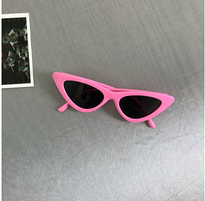 Retro cat-eye sunglasses with a tortoiseshell frame and dark lenses, ideal for a stylish, vintage look. - Image 17