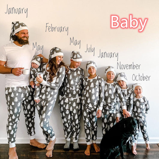 Family of seven and a dog in matching grey Christmas tree print pajamas with white cuffs and beanies. - Image 8