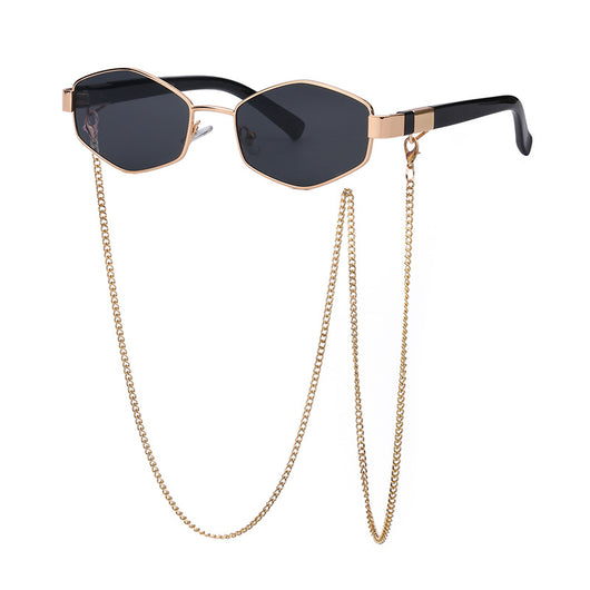 Women's hexagonal sunglasses with dark lenses, gold-colored metal frame, black temples, and a detachable gold chain. - Image 10