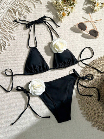 Black two-piece bikini with white 3D flower embellishments on the triangle top and tie-side bottom. - Image 13