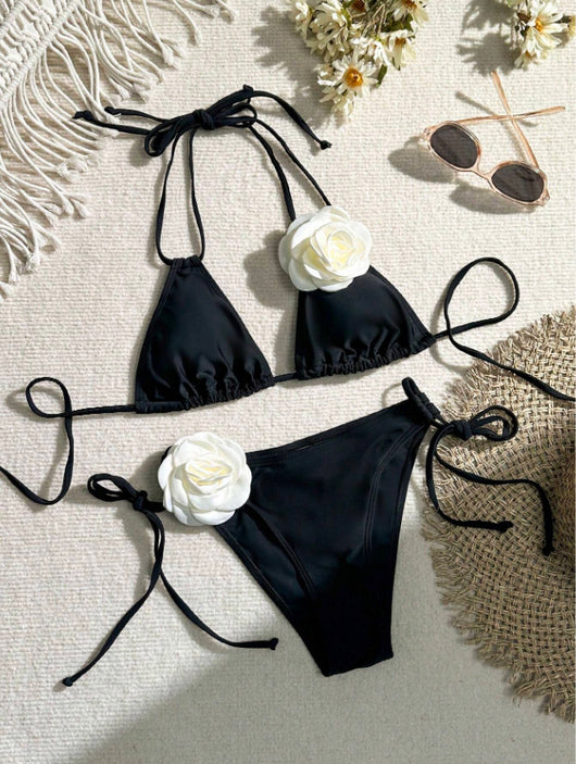 Black two-piece bikini with white 3D flower embellishments on the triangle top and tie-side bottom. - Image 13