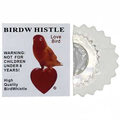 Red bird whistle with a serrated metal edge, next to a white label featuring a bird on a heart and a warning. - Image 13