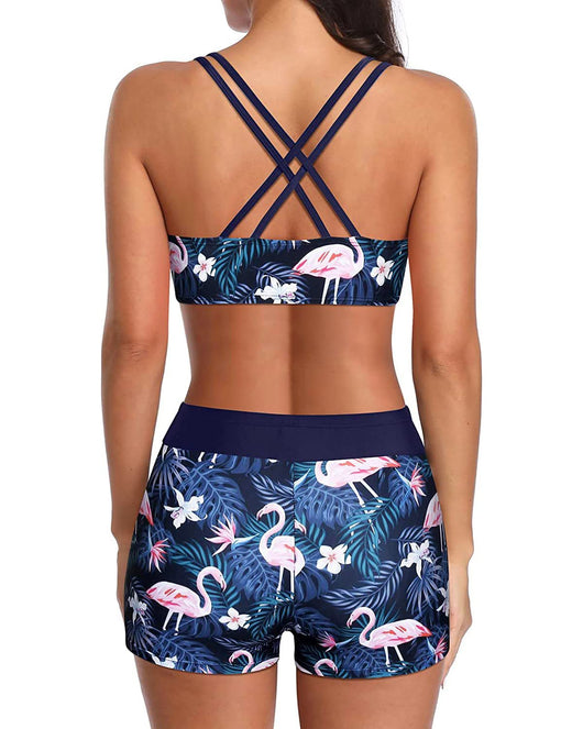 Women's three-piece swimsuit with a black tankini top, colorful geometric patterned bikini top, and matching swim shorts. - Image 30
