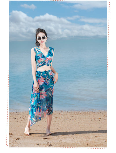 Women's light blue tropical leaf print three-piece swimsuit with short sleeve bikini top, bottoms, and sarong skirt. - Image 36