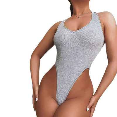 Woman wearing a light grey ribbed halter bodysuit with a deep V-neckline and high-cut leg design. - Image 4