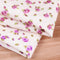 Tela Estampada Poliéster Flores Rojas y Hojas Verdes sobre Base Beige