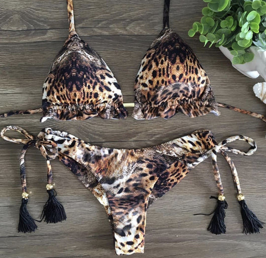 Women's tropical floral print bikini with a halter top, ruffled edges, and tie-side bottoms with pink tassels. - Image 15
