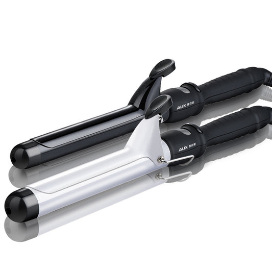 Two AUX curling irons, one black and one white, with ceramic glaze barrels and black handles, on a reflective surface.