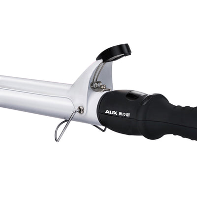 Two AUX curling irons, one black and one white, with ceramic glaze barrels and black handles, on a reflective surface. - Image 3