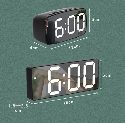 Modern rectangular digital alarm clock with a mirrored face and large, colorful LED numbers displaying the time. - Image 18