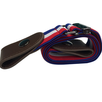 Black buckle-free elastic belt with snap closures worn on blue jeans, featuring a bonus gold-colored metal buckle. - Image 11