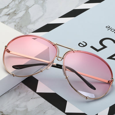 Aviator sunglasses with light blue lenses and a gold-colored metal frame, featuring a double bridge design. - Image 5