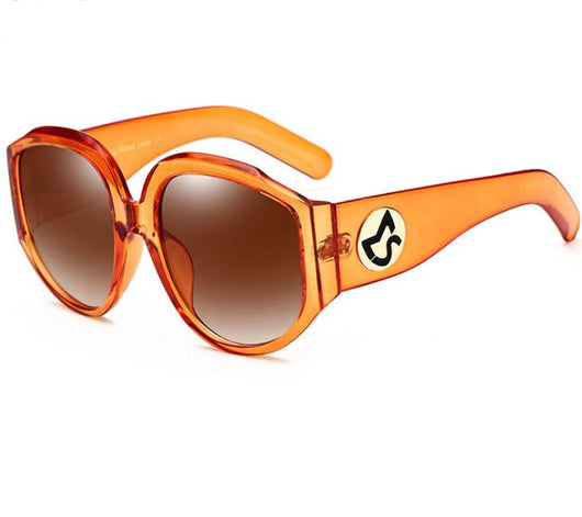 Oversize round sunglasses for women with olive frames, dark gradient lenses, and a gold emblem on the temples. - Image 7